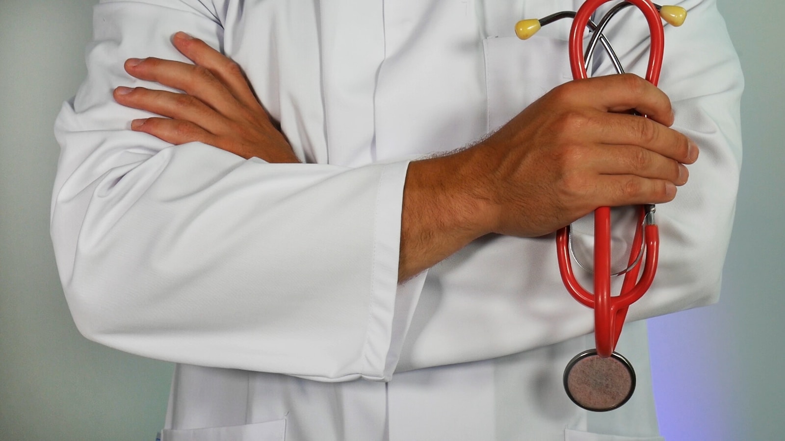 doctor holding red stethoscope health